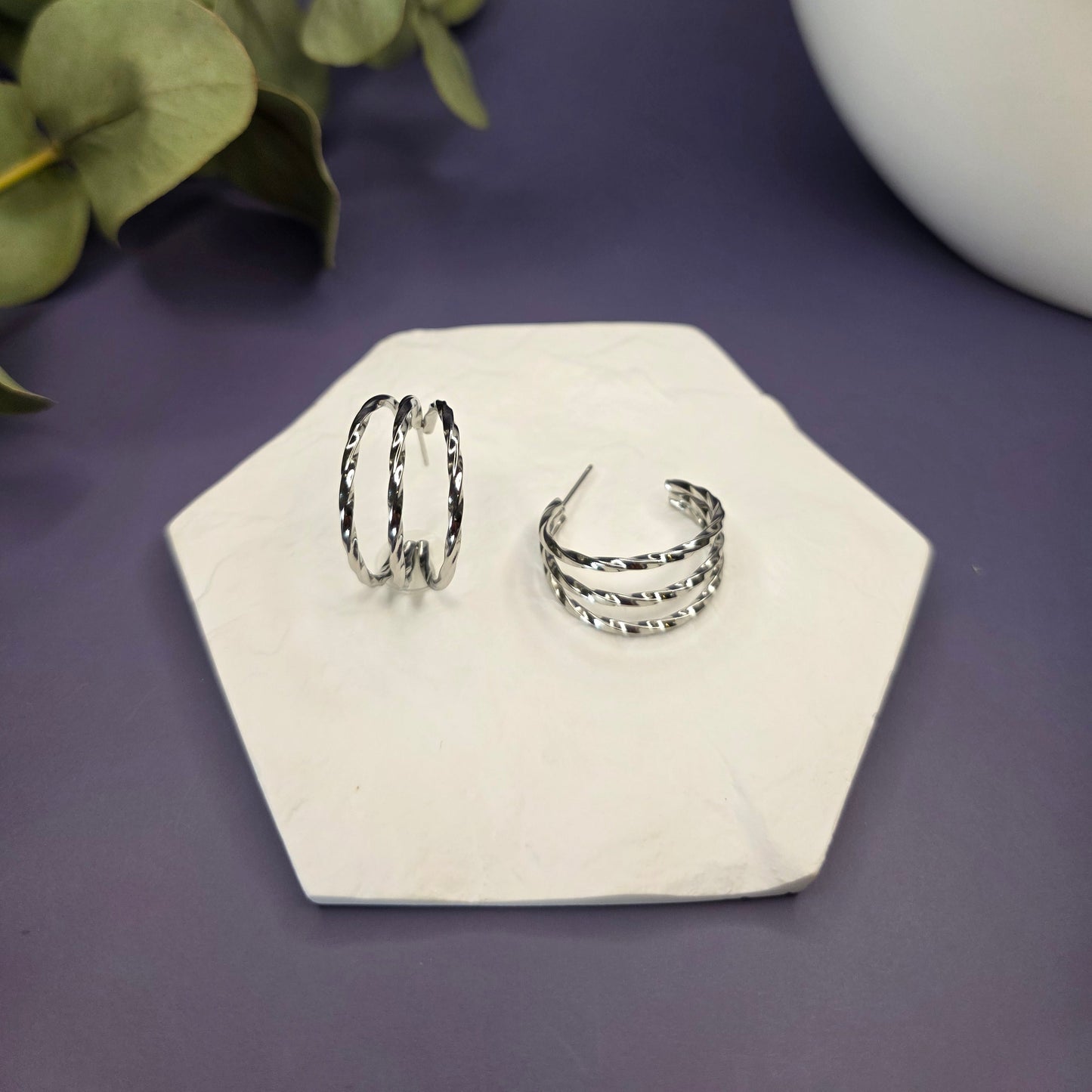 Silver Twist Hoops on a textured stone flat lay — My Silver Lining.