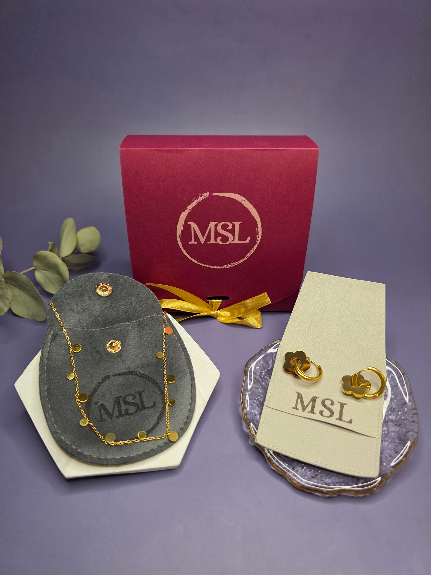 Professional display of the Golden Glow Retro collection featuring 18k gold plated 316 stainless steel flower earrings and a 304 stainless steel dew drop necklace.