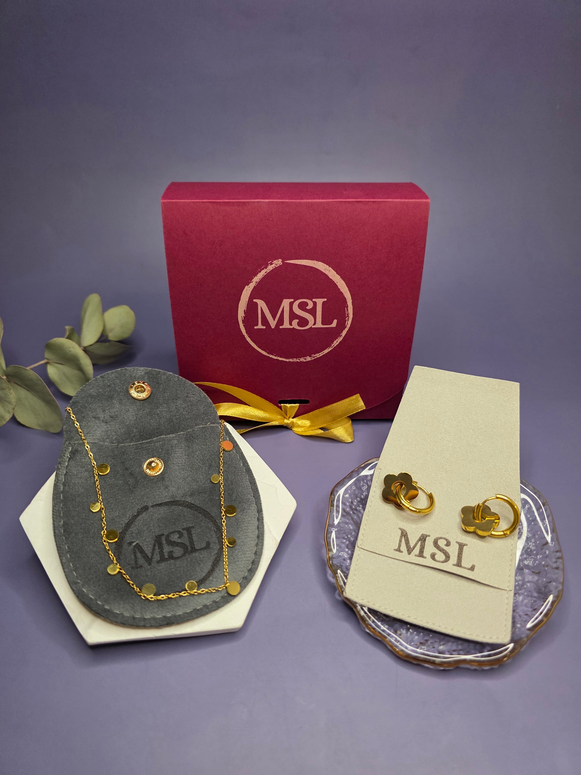 Professional display of the Golden Glow Retro collection featuring 18k gold plated 316 stainless steel flower earrings and a 304 stainless steel dew drop necklace.