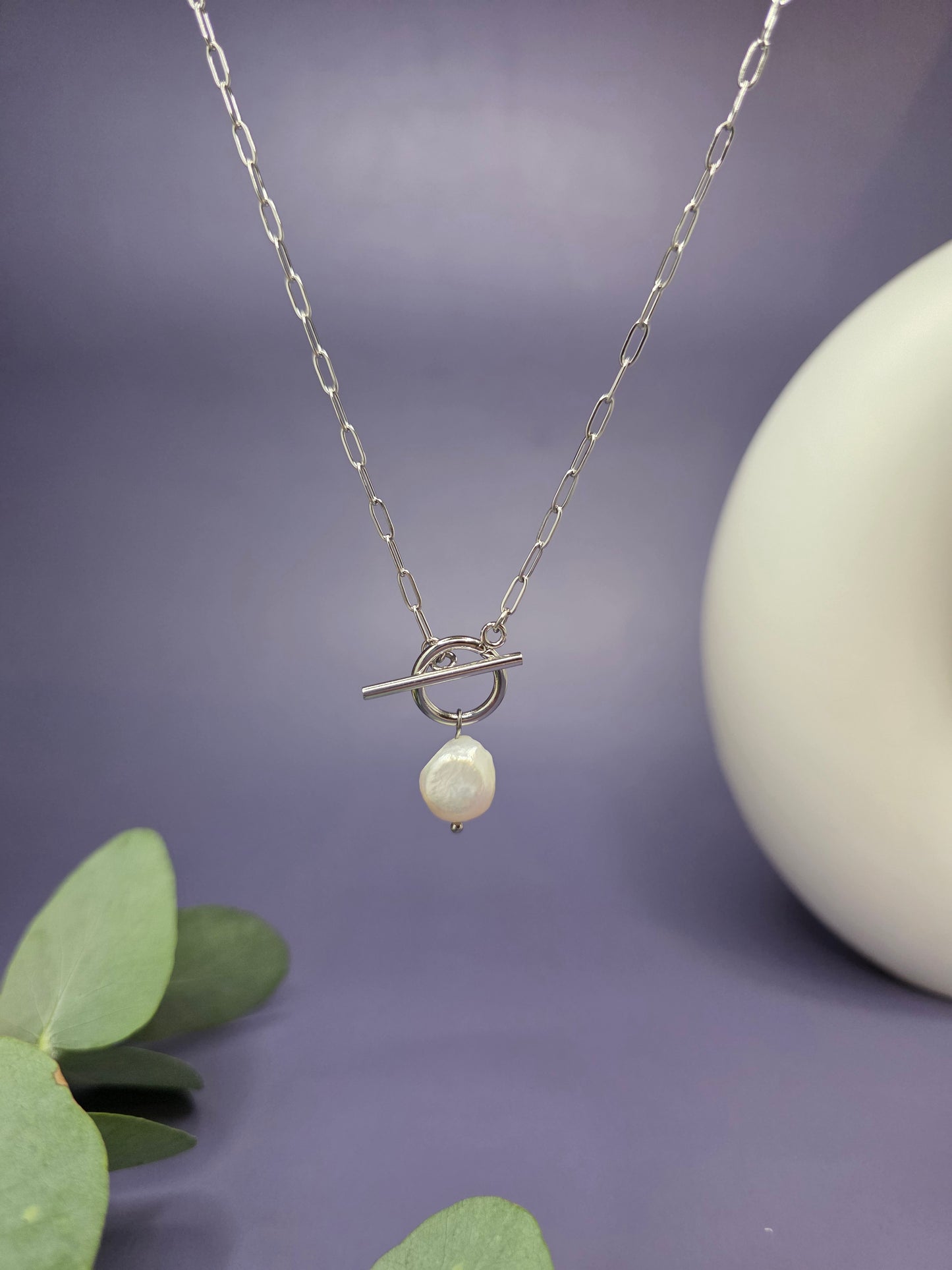 A floating Luna T-Bar Pearl Necklace with a silver paperclip chain and a unique freshwater baroque pearl pendant, 100% waterproof jewelry by My Silver Lining.