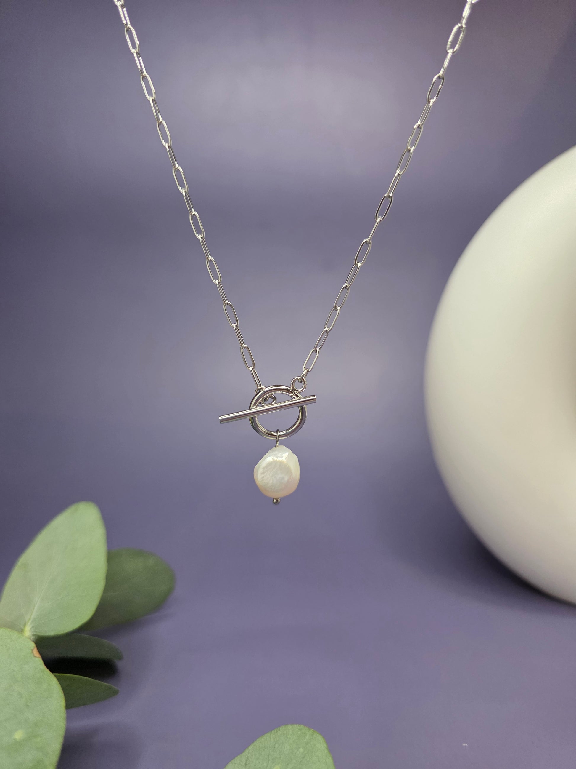 A floating Luna T-Bar Pearl Necklace with a silver paperclip chain and a unique freshwater baroque pearl pendant, 100% waterproof jewelry by My Silver Lining.