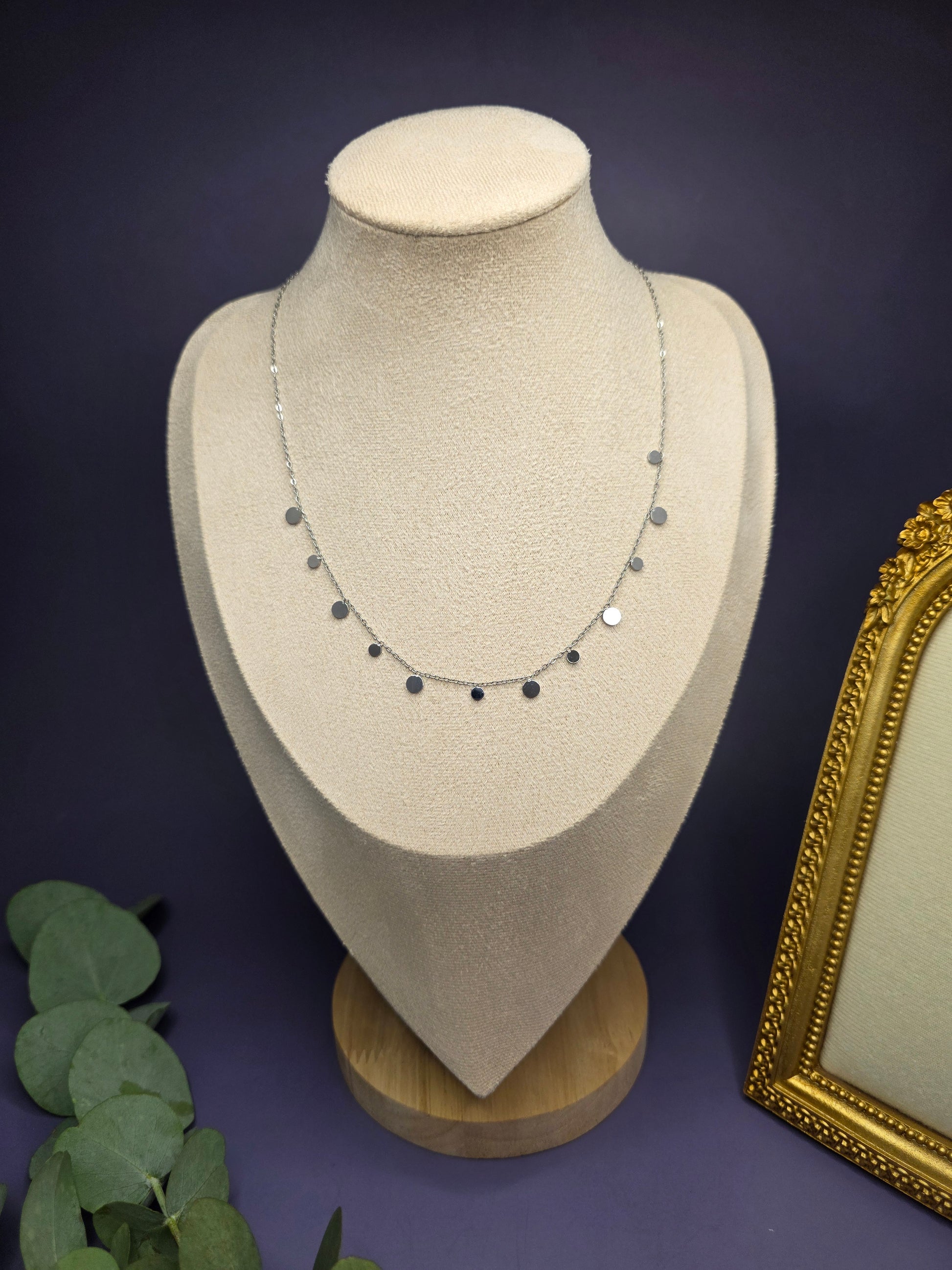 A Silver Dewdrop Necklace elegantly draped on a fabric mannequin bust, showcasing the adjustable 40+5cm fit and modern sophistication of My Silver Lining.