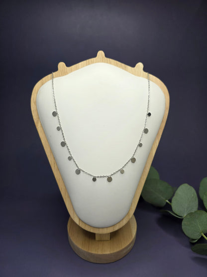 Delicate Silver Dewdrop Necklace made of 304 stainless steel shown on a wooden jewelry bust, high-quality tarnish-resistant jewelry by My Silver Lining.