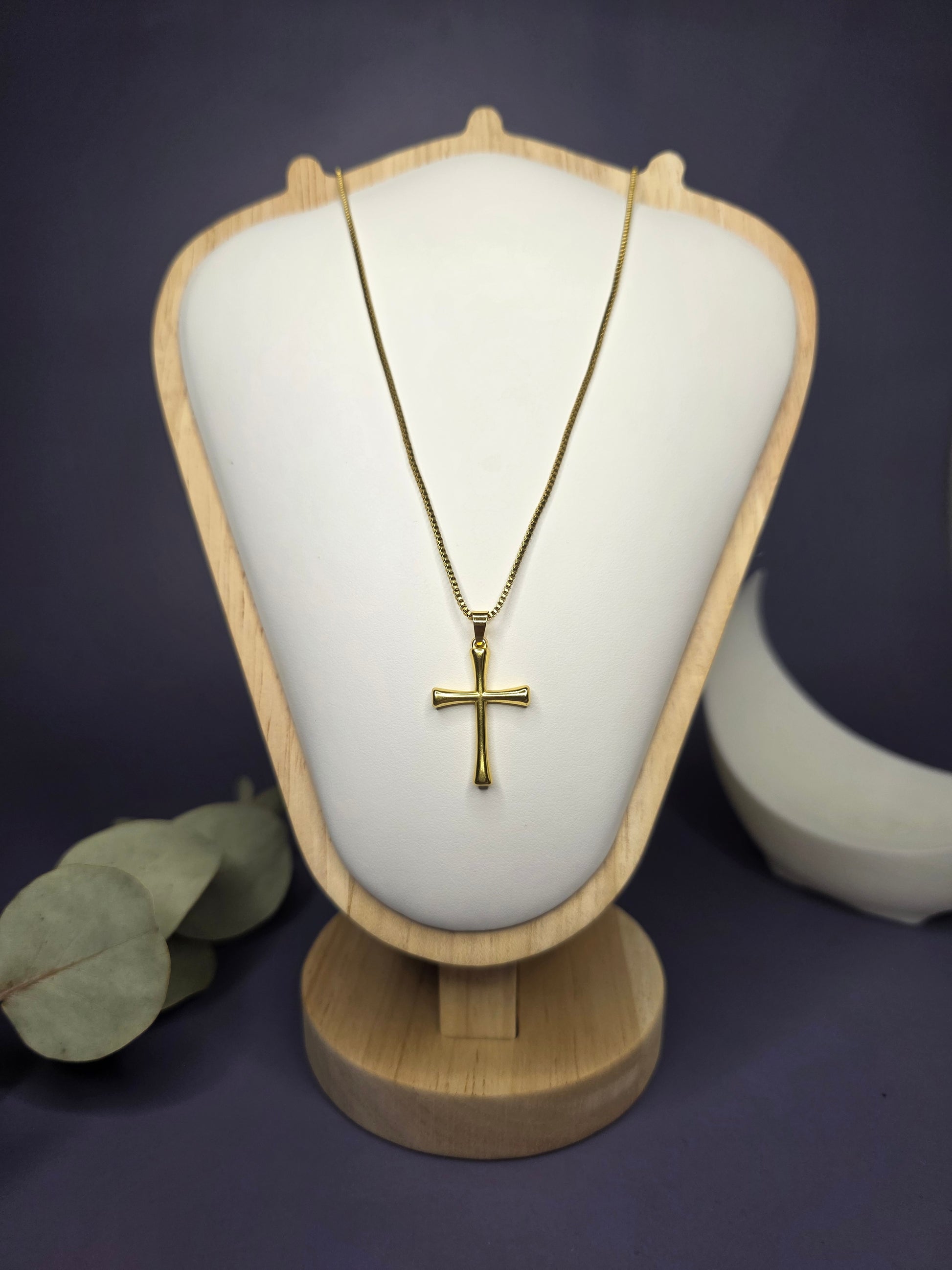 Front view of the Anchor of Faith gold cross necklace on a jewelry bust, showcasing the polished pendant and 50cm chain fit — My Silver Lining.