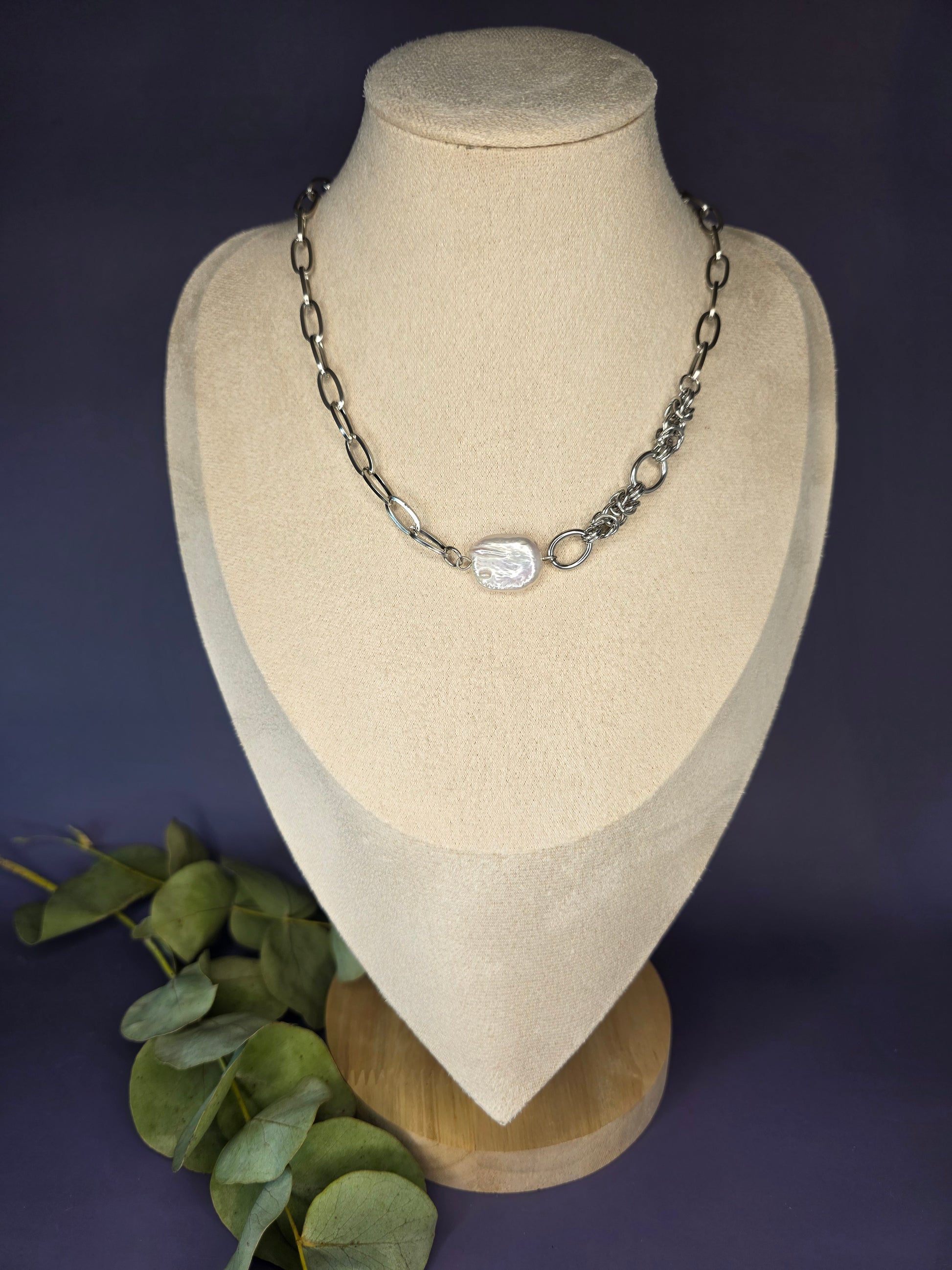 My Silver Lining silver necklace on a display bust, showcasing a pendant made of a genuine freshwater baroque pearl and a tarnish-resistant silver chain.