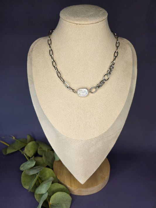 My Silver Lining silver necklace on a display bust, showcasing a pendant made of a genuine freshwater baroque pearl and a tarnish-resistant silver chain.