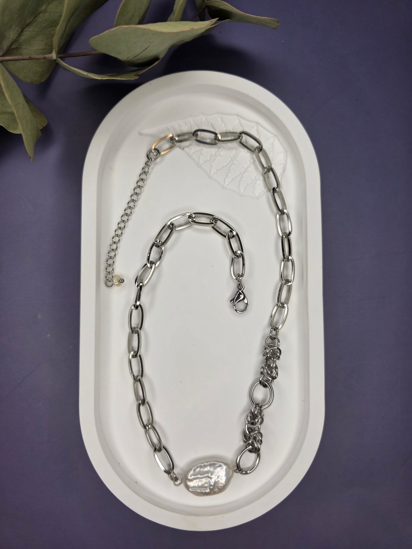 A flat lay of a My Silver Lining pendant necklace showing the adjustable 5cm extender and mixed-link silver jewelry design suitable for everyday wear.