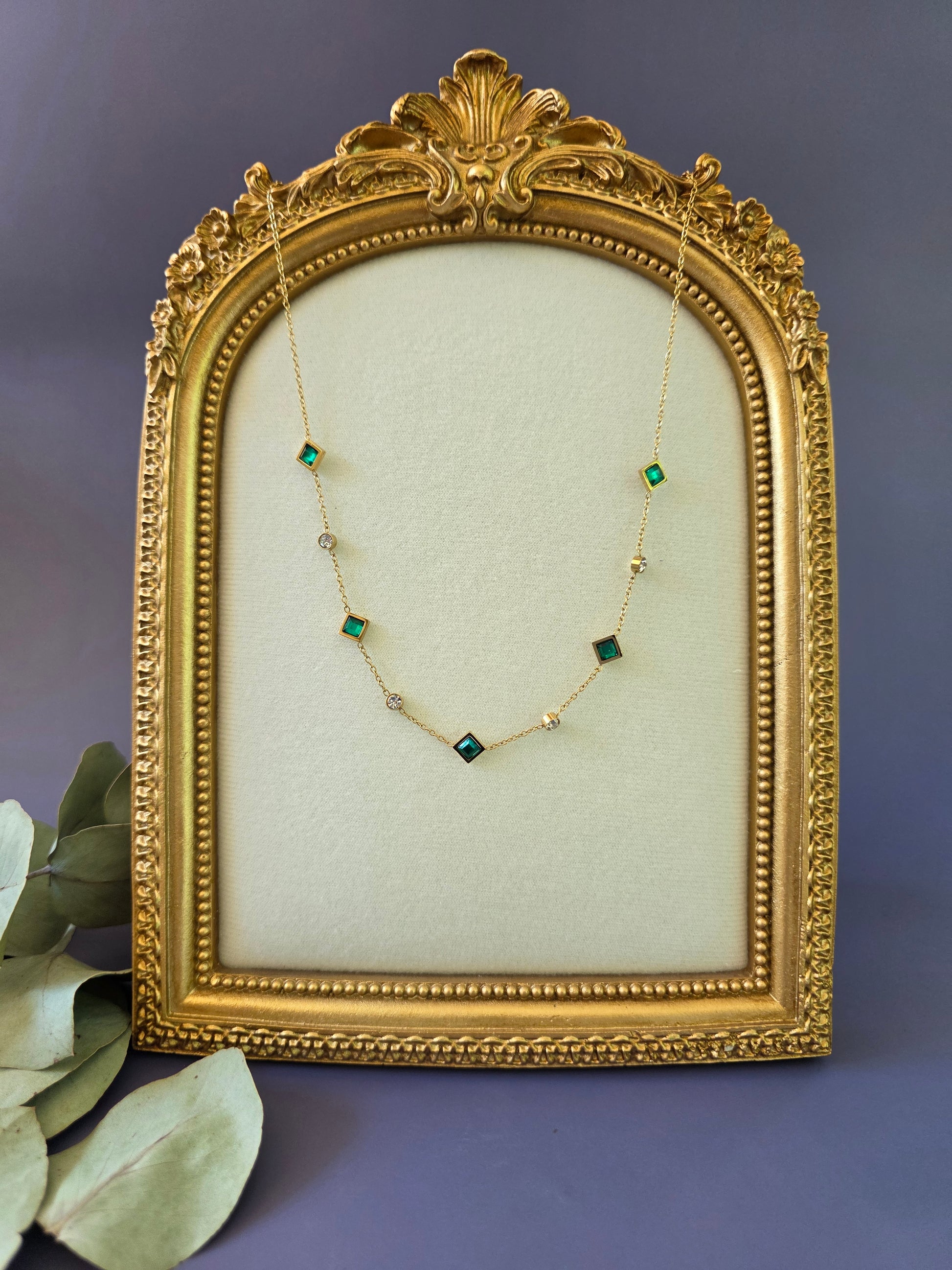 Emerald Glow Station necklace featuring green square-cut stones in a vintage gold frame. This waterproof and tarnish-resistant gold-plated necklace is perfect for elegant daily wear - My Silver Lining.