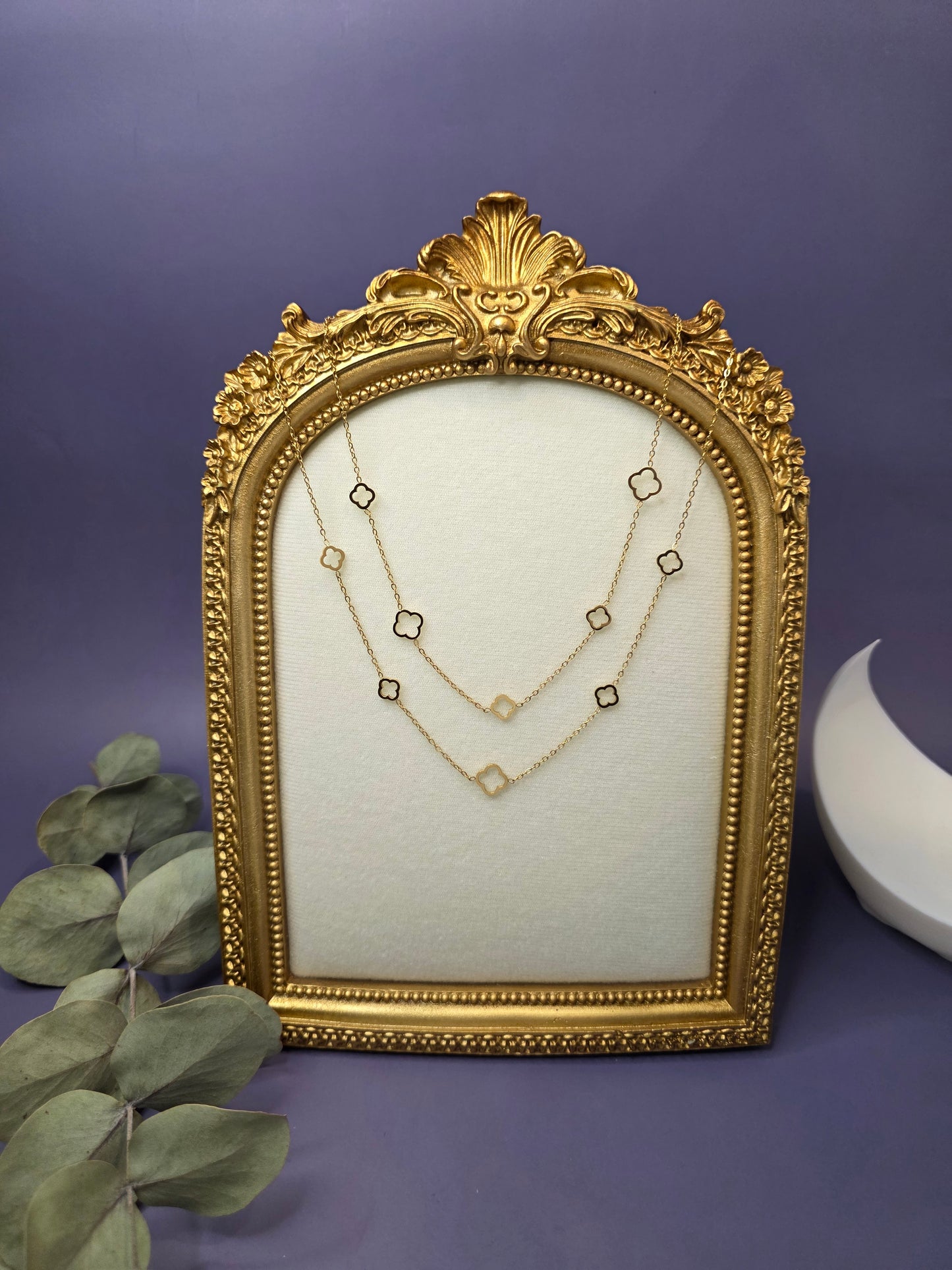 18K gold-plated Four-Leaf Glow Chain. This waterproof layered necklace features clover and eye charms on a tarnish-resistant stainless steel base - My Silver Lining.