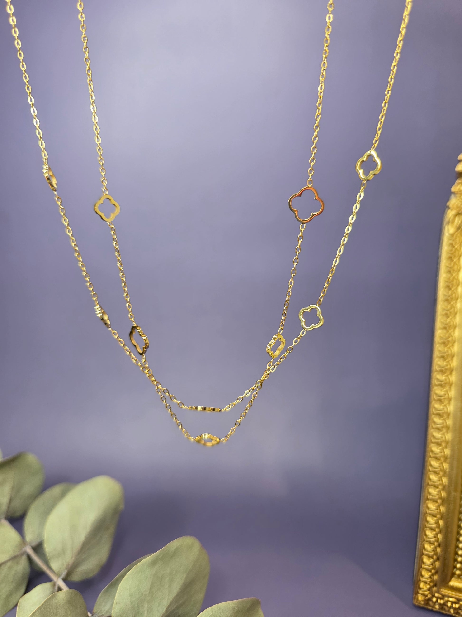 Close-up of the Four-Leaf Glow gold station necklace showcasing the intricate clover and protective eye charms. High-quality hypoallergenic and waterproof jewelry from My Silver Lining.