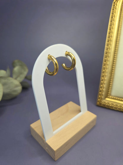 Golden Hollow C-Hoops displayed on a white architectural arch. These 18k gold plated 316 stainless steel earrings are waterproof, non-tarnish, and designed for sensitive skin — My Silver Lining.