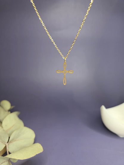 Close-up of the Golden Infinity Cross Necklace hanging, highlighting the polished gold-toned stainless steel — My Silver Lining.