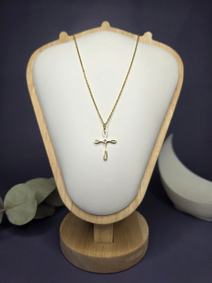 Front view of the Golden Infinity Cross pendant on a jewelry bust, showcasing the gold-toned finish and 42cm length — My Silver Lining.
