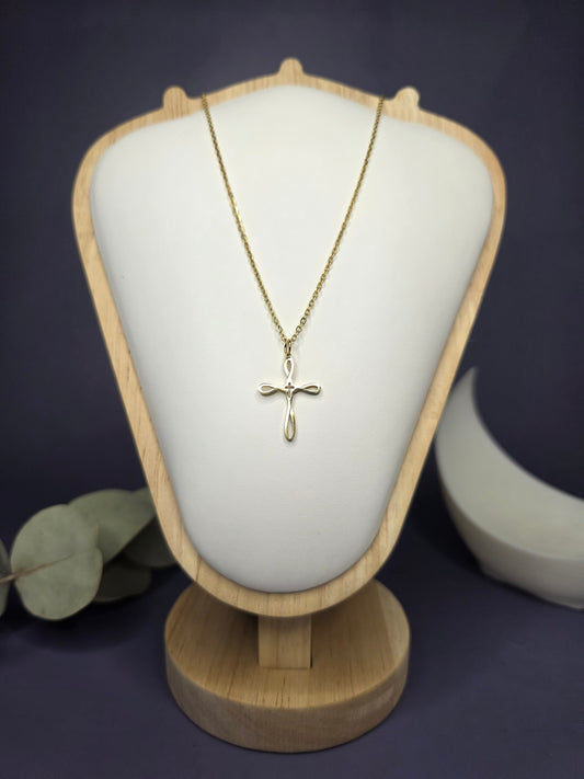Front view of the Golden Infinity Cross pendant on a jewelry bust, showcasing the gold-toned finish and 42cm length — My Silver Lining.