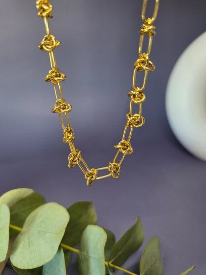 SEO optimized Golden Love Knot Chain featuring intricate 18K gold-plated links. This waterproof and tarnish-resistant stainless steel necklace offers a symbolic and modern look in South Africa - My Silver Lining.