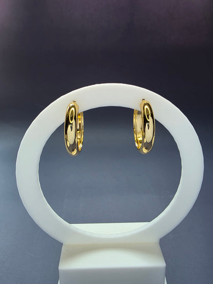 Line of Luxe hoops featured on a white arch jewelry stand. These 304 stainless steel waterproof huggies provide a bold, polished silhouette and a tarnish-resistant finish for daily wear - My Silver Lining.