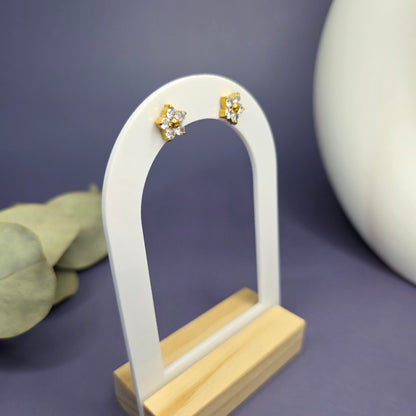SEO optimized angled shot of the floral zircon studs on a white display stand, showcasing their $1\text{ cm}$ size — My Silver Lining.