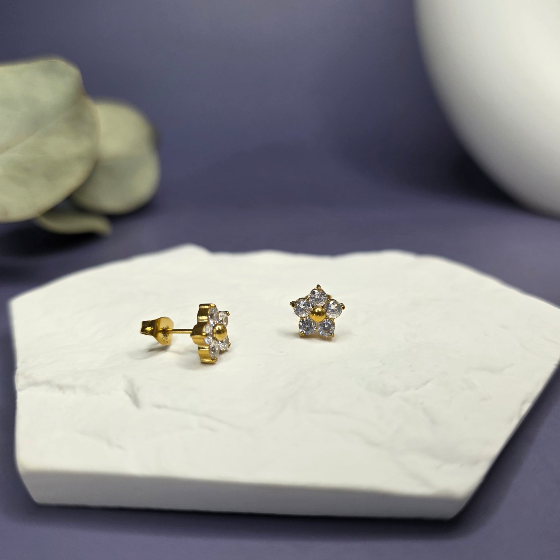 SEO optimized close-up of Modern Grace Floral Studs on a white stone, showing the sparkling synthetic zircon petals — My Silver Lining.