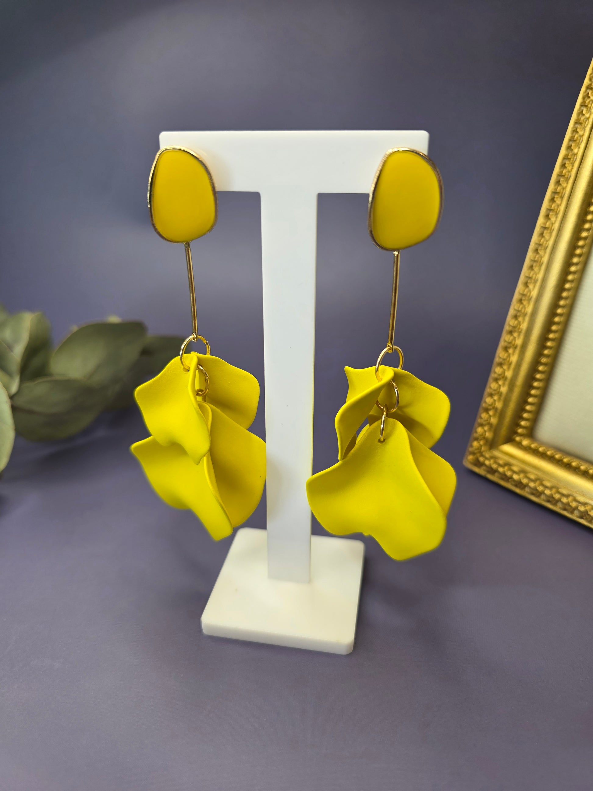 The French Riviera Petal Drop Earrings. Large, 9.2 cm long statement earrings featuring layered acrylic petals in a cascading floral design. Secured with a 316 Stainless Steel ear needle.