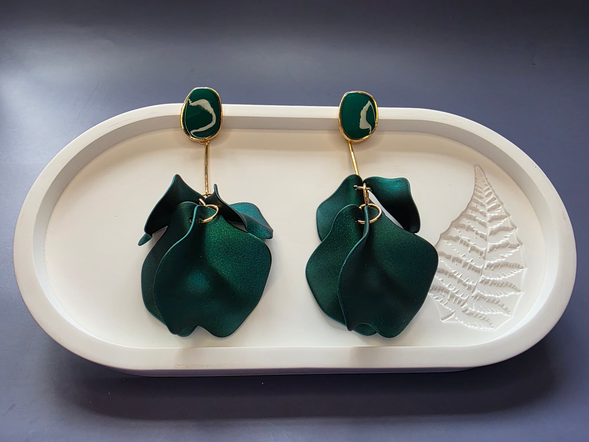 The French Riviera Petal Drop Earrings. Large, 9.2 cm long statement earrings featuring layered acrylic petals in a cascading floral design. Secured with a 316 Stainless Steel ear needle.