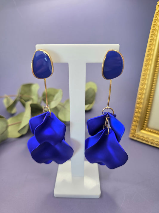 The French Riviera Petal Drop Earrings. Large, 9.2 cm long statement earrings featuring layered acrylic petals in a cascading floral design. Secured with a 316 Stainless Steel ear needle.