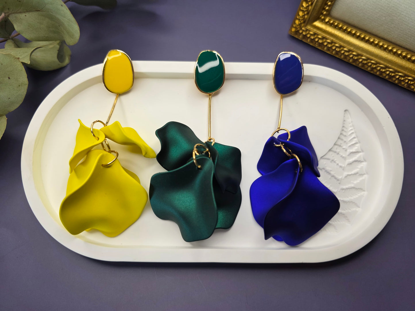 The French Riviera Petal Drop Earrings. Large, 9.2 cm long statement earrings featuring layered acrylic petals in a cascading floral design. Secured with a 316 Stainless Steel ear needle.