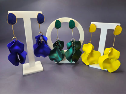 The French Riviera Petal Drop Earrings. Large, 9.2 cm long statement earrings featuring layered acrylic petals in a cascading floral design. Secured with a 316 Stainless Steel ear needle.