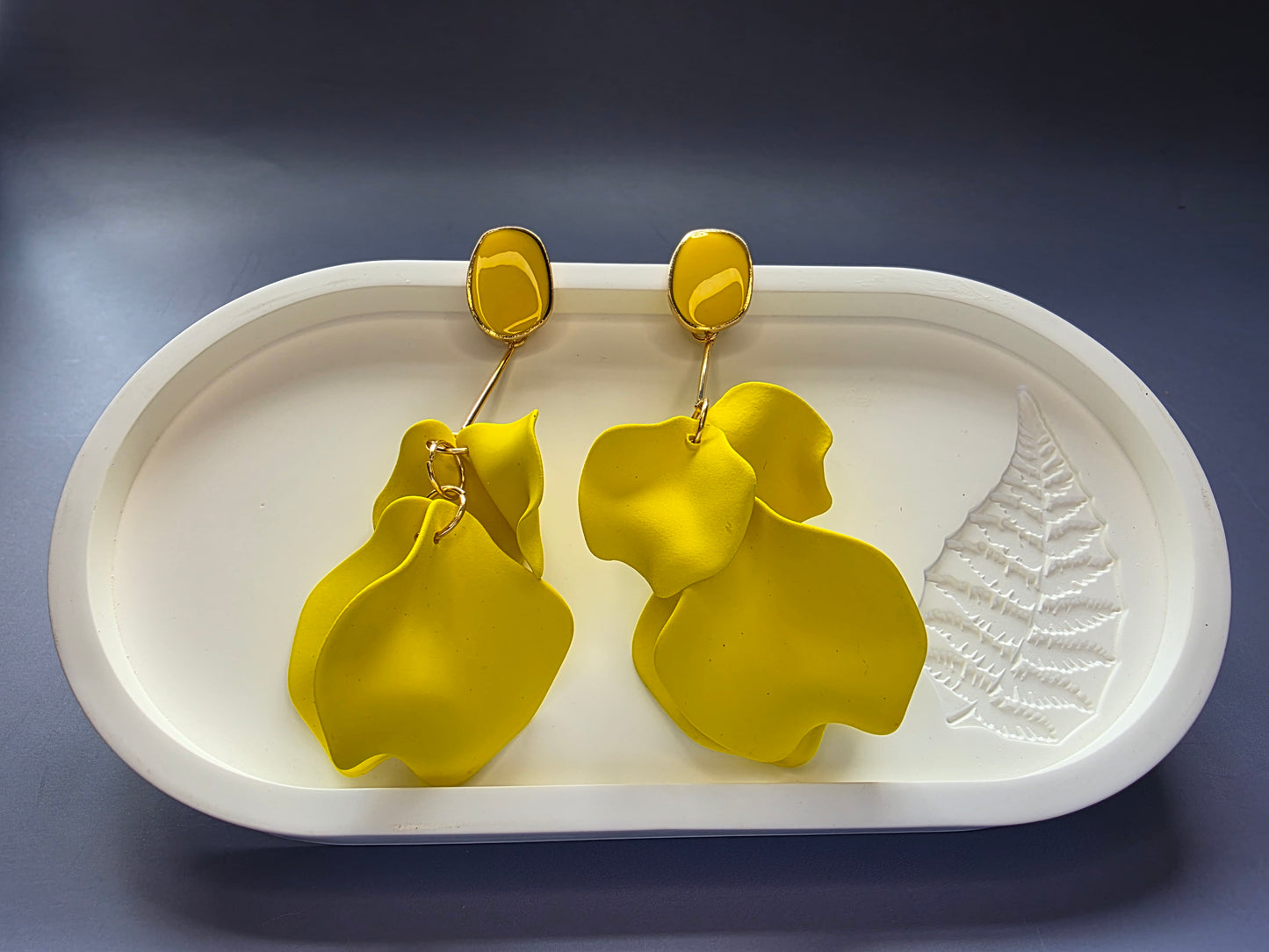 The French Riviera Petal Drop Earrings. Large, 9.2 cm long statement earrings featuring layered acrylic petals in a cascading floral design. Secured with a 316 Stainless Steel ear needle.