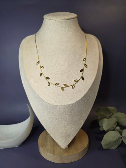 Nature-inspired willow leaf necklace arranged with eucalyptus accents. This waterproof gold jewelry piece highlights the unique craftsmanship of 18k gold plating on stainless steel for lasting sophistication - My Silver Lining.