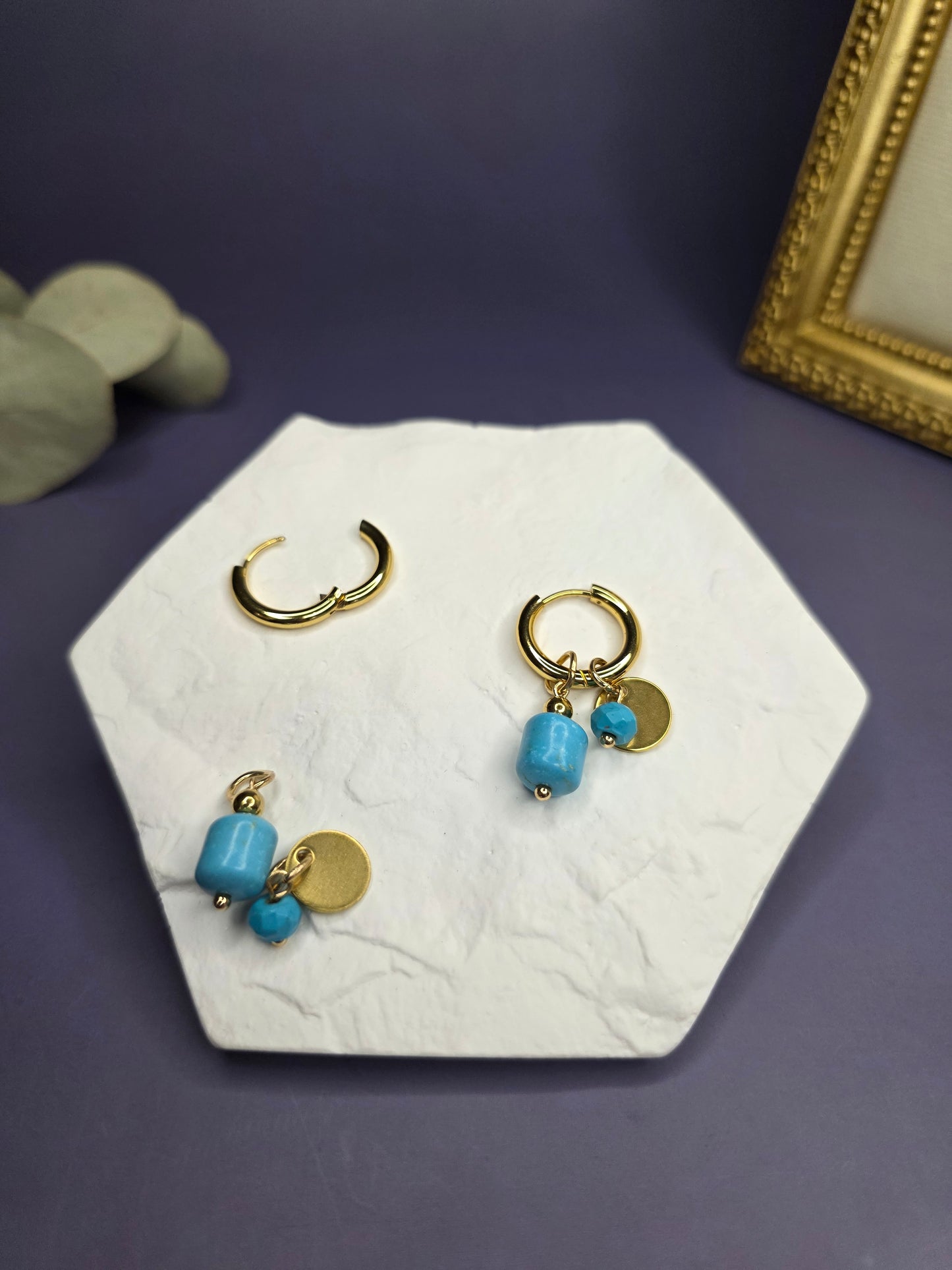 Nomad Turquoise Hoops shown on a white hexagon stone, demonstrating the removable stone charms and the standalone gold huggie sleeper — My Silver Lining.