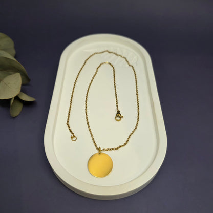 Optimized close-up of the polished 1.8cm gold disc pendant, perfect for custom initial or date engraving — My Silver Lining.