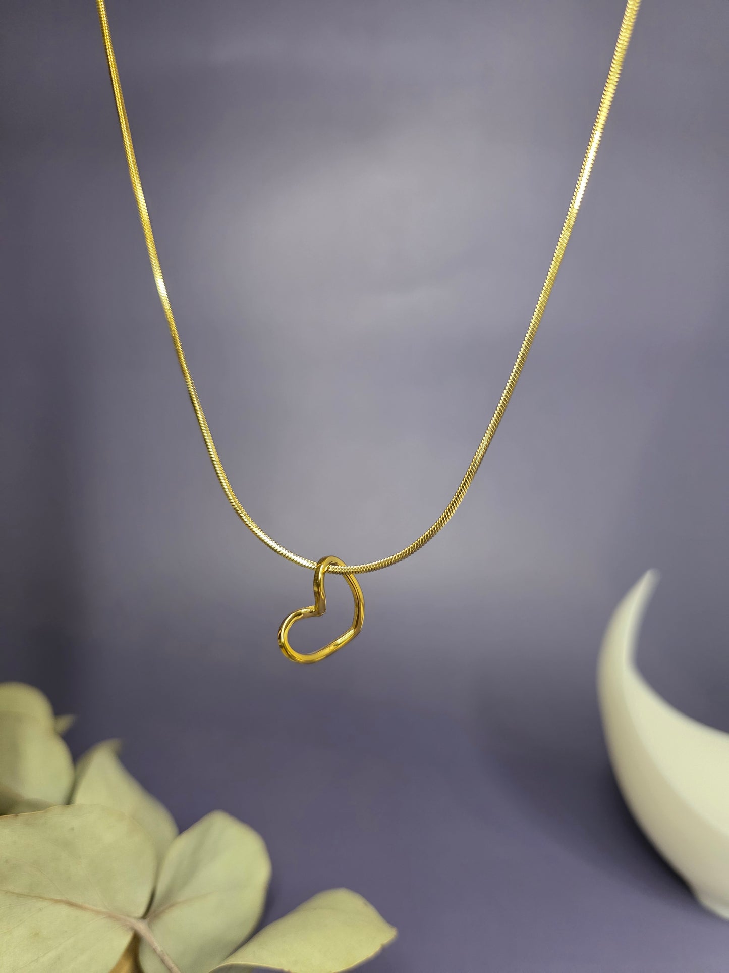 Close-up of the Pure Heart Golden Pendant Necklace in 316 stainless steel, featuring a minimalist open heart design with KC Gold plating — My Silver Lining.