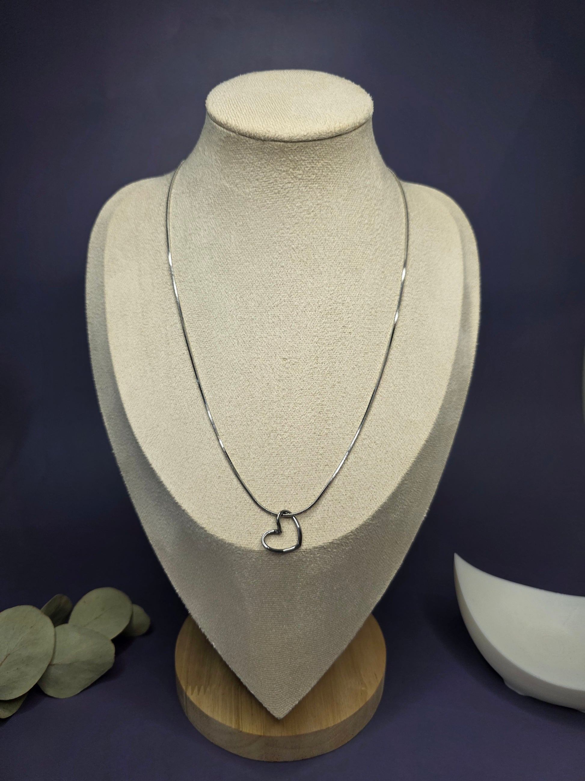View of the Pure Heart Silver Pendant Necklace worn on a jewelry bust, showing the 45cm fit and elegant silver-toned finish — My Silver Lining.