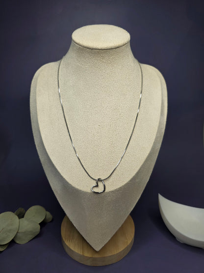 View of the Pure Heart Silver Pendant Necklace worn on a jewelry bust, showing the 45cm fit and elegant silver-toned finish — My Silver Lining.