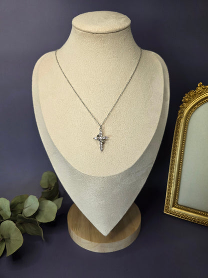 Shimmering Silver Grace necklace styled on a white jewelry bust. This stainless steel pave cross pendant features sparkling cubic zirconia and a waterproof finish - My Silver Lining.