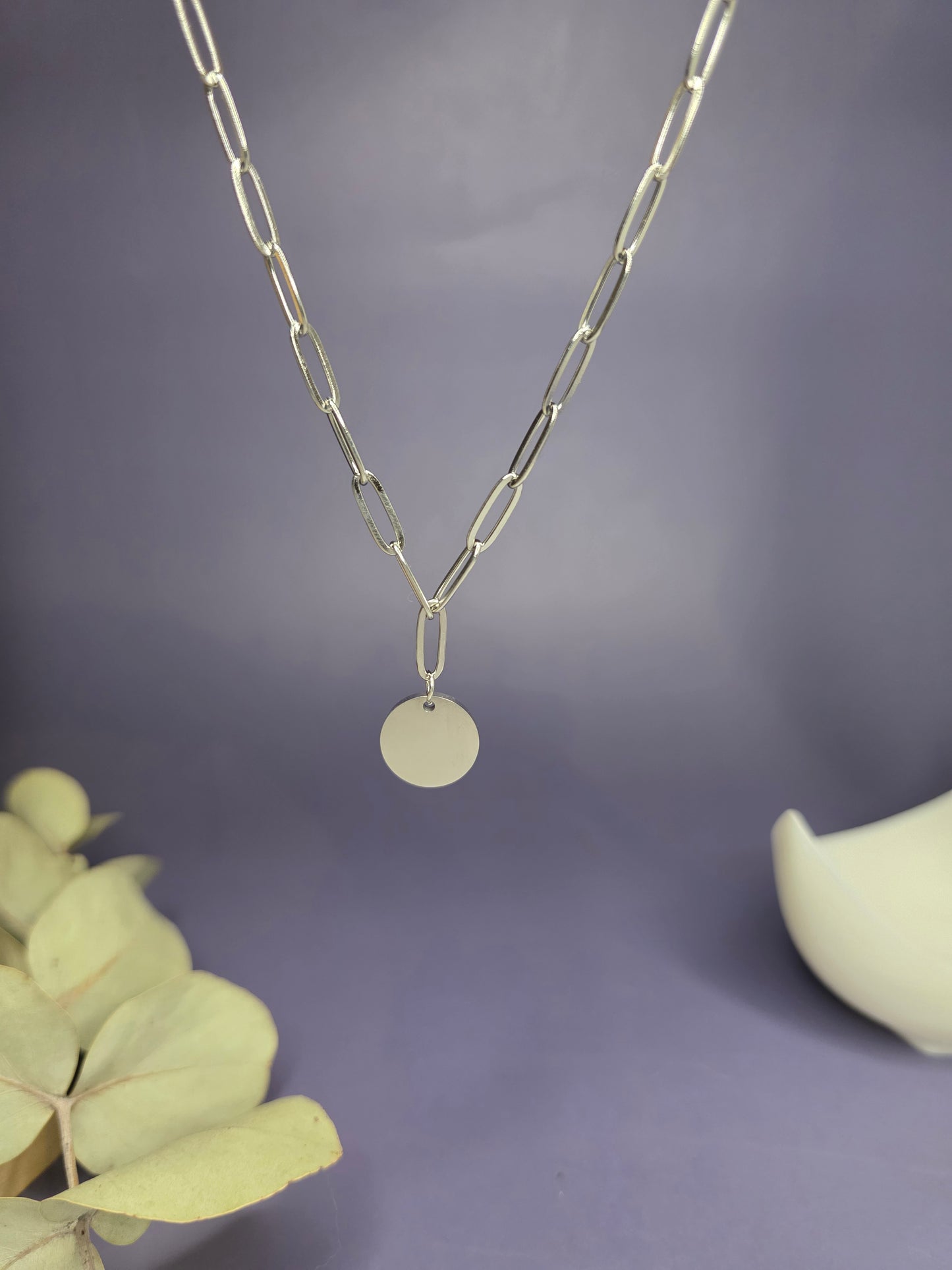 Close-up of the Signature Silver Disc Necklace hanging, highlighting the 15mm engravable pendant — My Silver Lining.