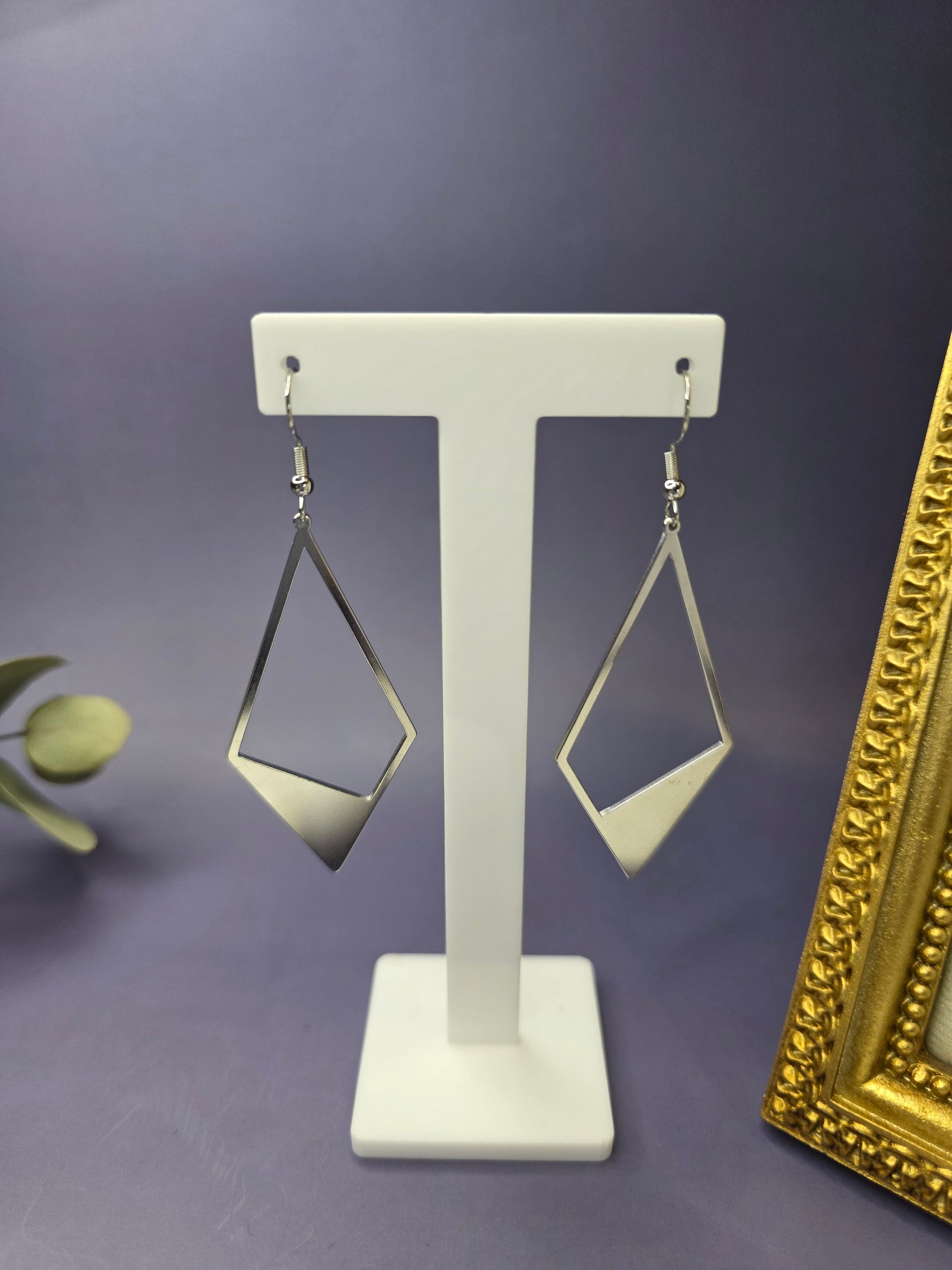 Silver Anchor Drops showcased on a white T-stand. These 7.4cm elongated kite earrings feature a bold geometric design in stainless steel - My Silver Lining.