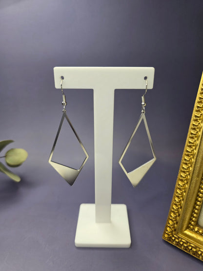 Silver Anchor Drops showcased on a white T-stand. These 7.4cm elongated kite earrings feature a bold geometric design in stainless steel - My Silver Lining.