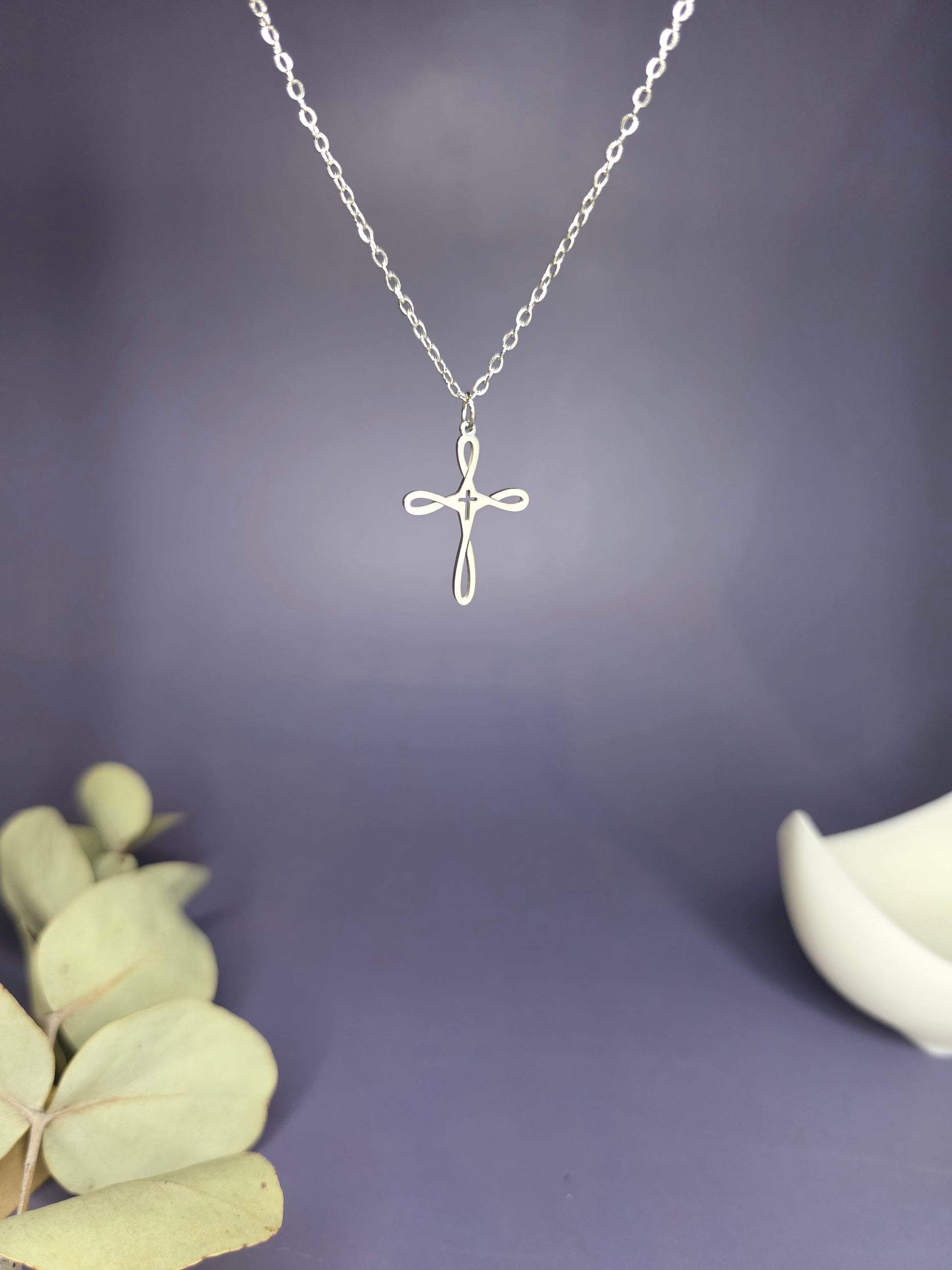 Close-up of the Silver Infinity Cross Necklace hanging, highlighting the durable 304 stainless steel finish — My Silver Lining.