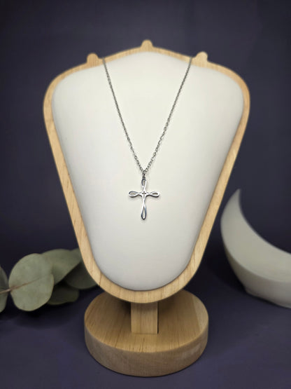 Front view of the Silver Infinity Cross pendant on a jewelry bust, showcasing the polished stainless steel and 42cm length — My Silver Lining.