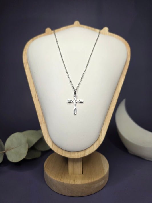 Front view of the Silver Infinity Cross pendant on a jewelry bust, showcasing the polished stainless steel and 42cm length — My Silver Lining.