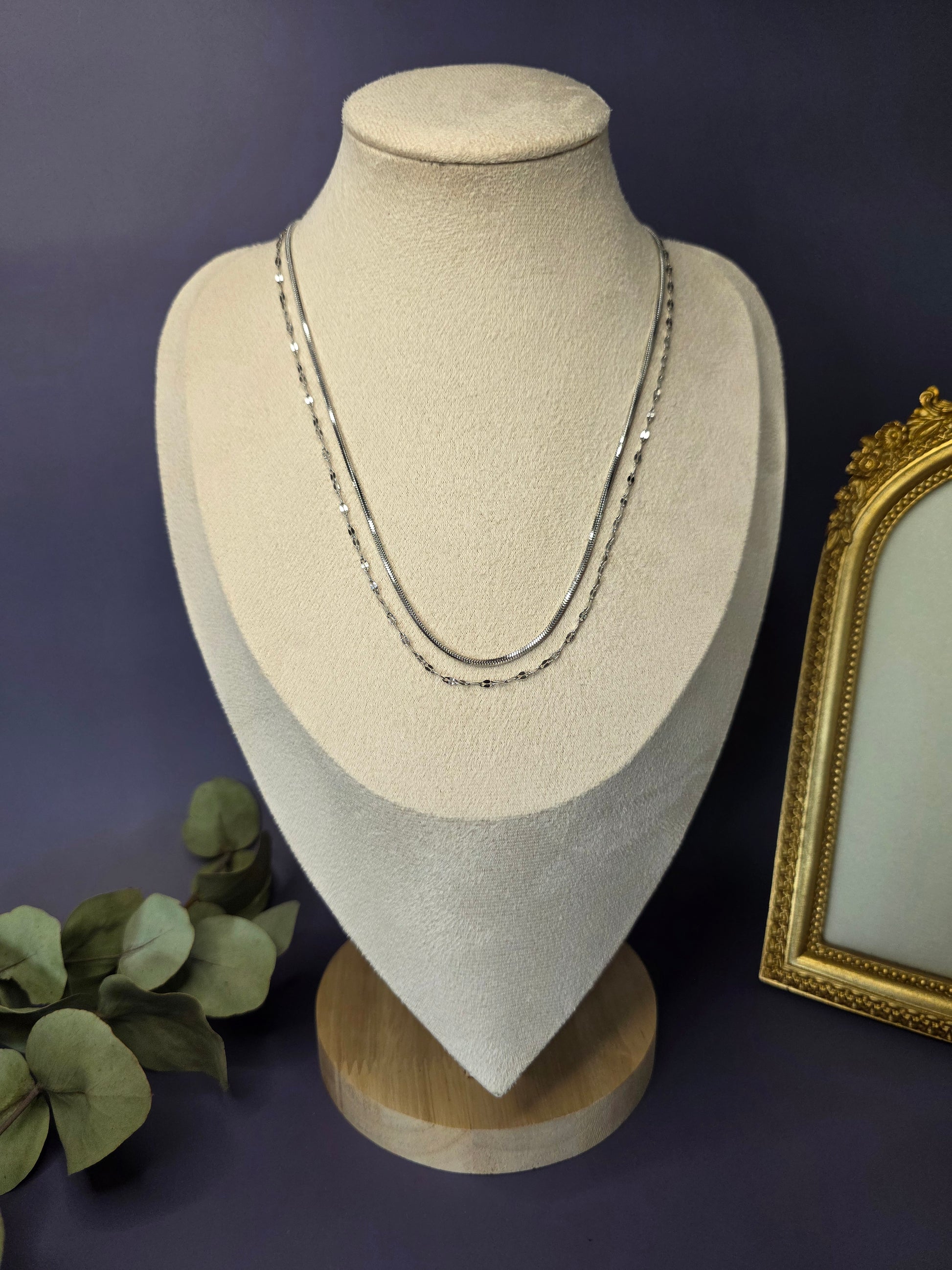 Silver Lustre Duo set styled on a white jewelry bust. This stainless steel layered necklace features a flat snake chain and beaded satellite chain - My Silver Lining.