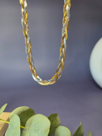 Trinity Braid necklace showcasing the intricate weave of gold, silver, and rose gold strands. This waterproof tri-tone stainless steel chain offers a multi-dimensional shimmer - My Silver Lining.