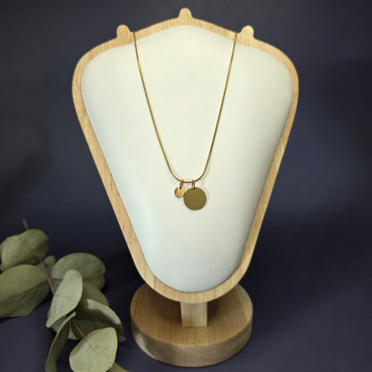 Front view of the Golden Mamma Bear necklace on a jewelry bust, showcasing the full variant with four smaller discs — My Silver Lining.
