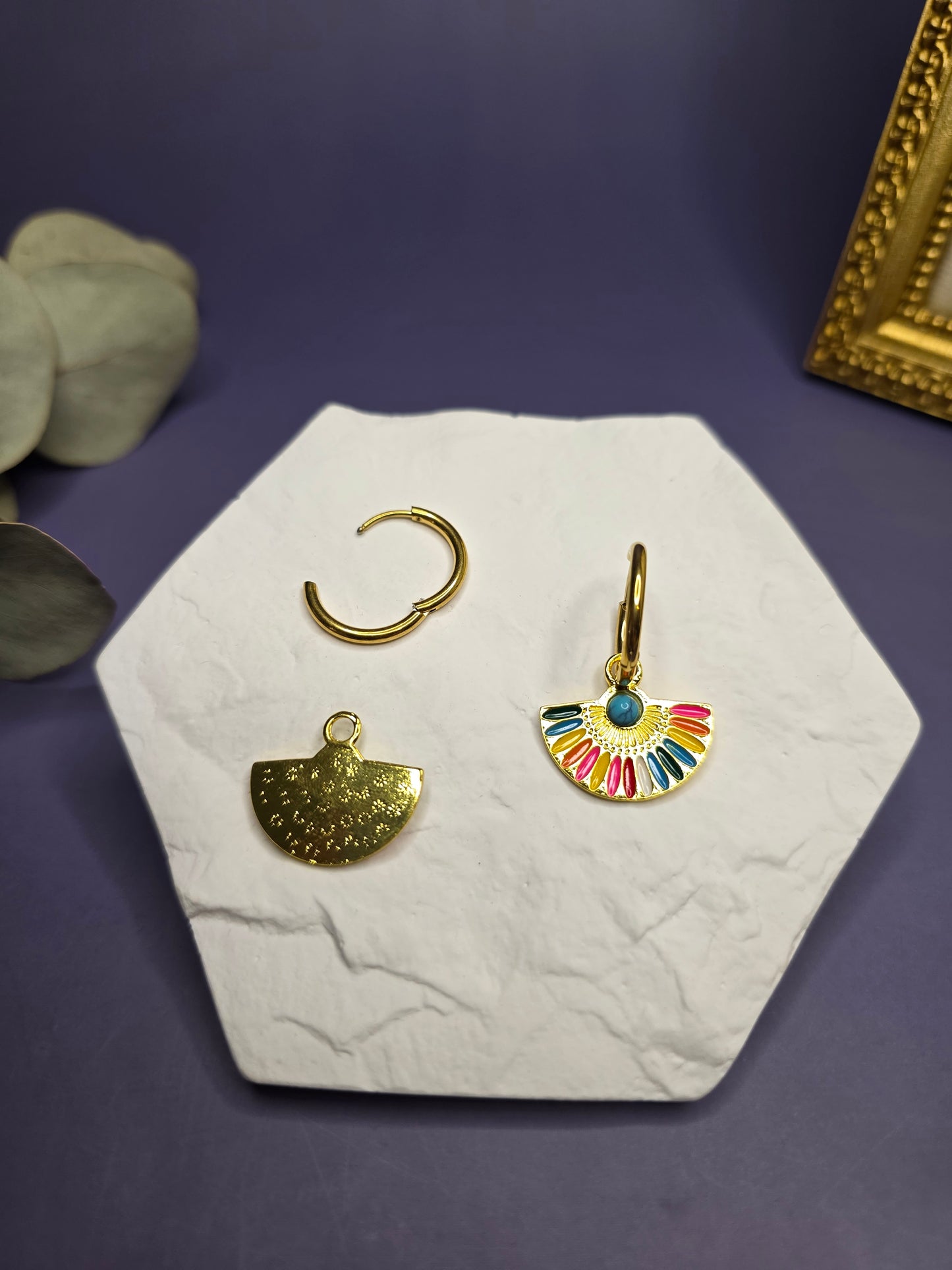 Vivid Fan Gold Hoops shown on a white hexagon stone, demonstrating the removable fan charm and the standalone gold hoop — My Silver Lining.
