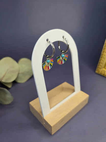 Side profile of Vivid Fan Silver Hoops on a white arch display, highlighting the secure silver hoop closure — My Silver Lining.