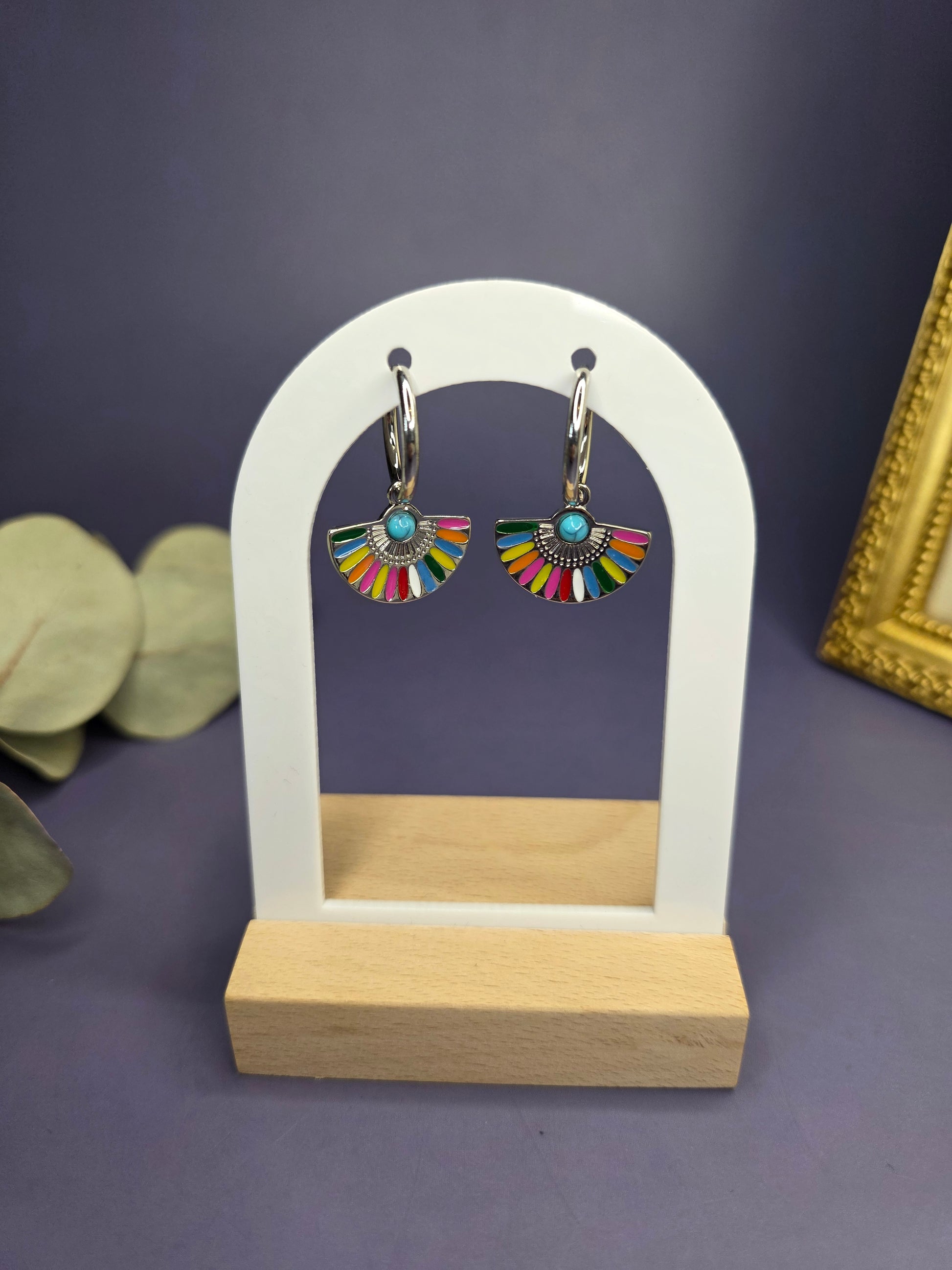 Vivid Fan Silver Hoops displayed on a white architectural arch. These silver-toned stainless steel earrings feature a vibrant resin inlay — My Silver Lining.