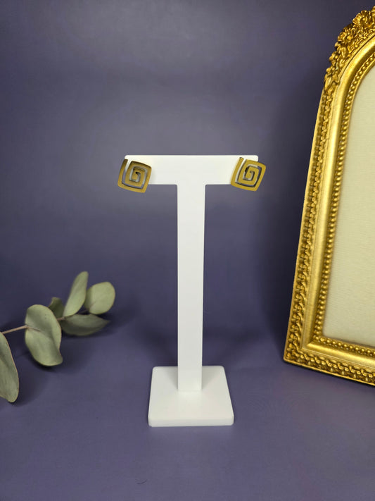 Vortex Gold Studs with a bold spiral design on a white T-stand. These KC gold-plated stainless steel earrings are waterproof and tarnish-resistant - My Silver Lining.