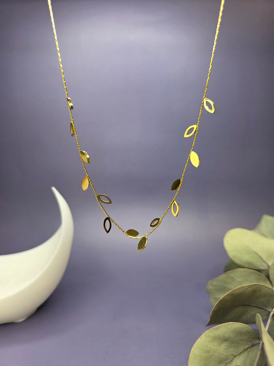 18k gold plated willow leaf necklace featuring alternating solid and open-work charms. This waterproof stainless steel botanical piece offers tarnish-resistant shine for a nature-inspired modern look - My Silver Lining.